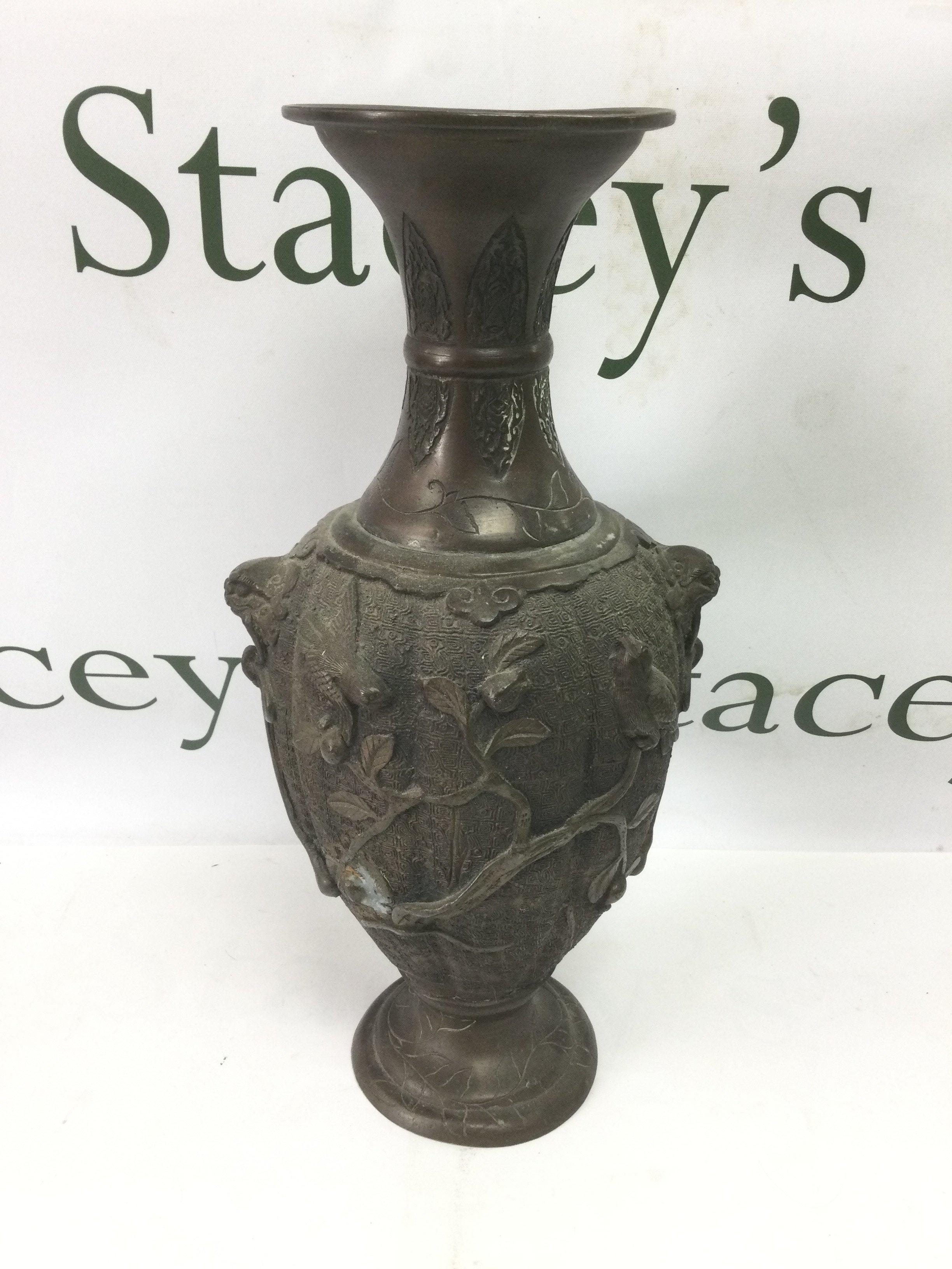 A Japanese bronzed vase decorated with applied birds amongst foliage, approx height 33cm. Shipping category C.- NO RESERVE