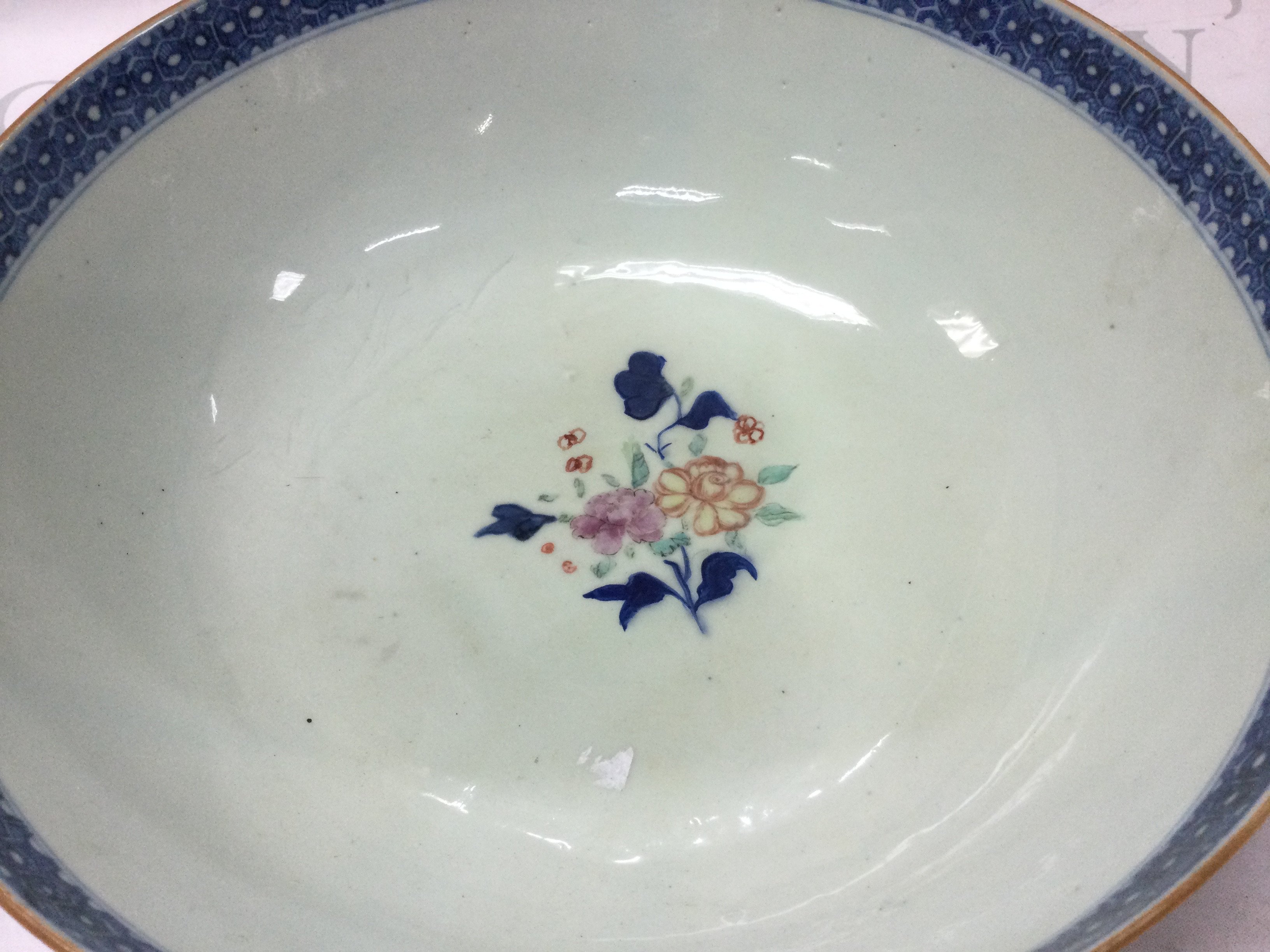 Chinese bowls including a Famille Rose Canton bowl, Famille Rose punch bowl (damaged with chips, hairline cracks and restoration) and another punch bowl decorated with figures. Dimensions ranging from 9cm tall 19cm wide to 12cm tall 28cm wide