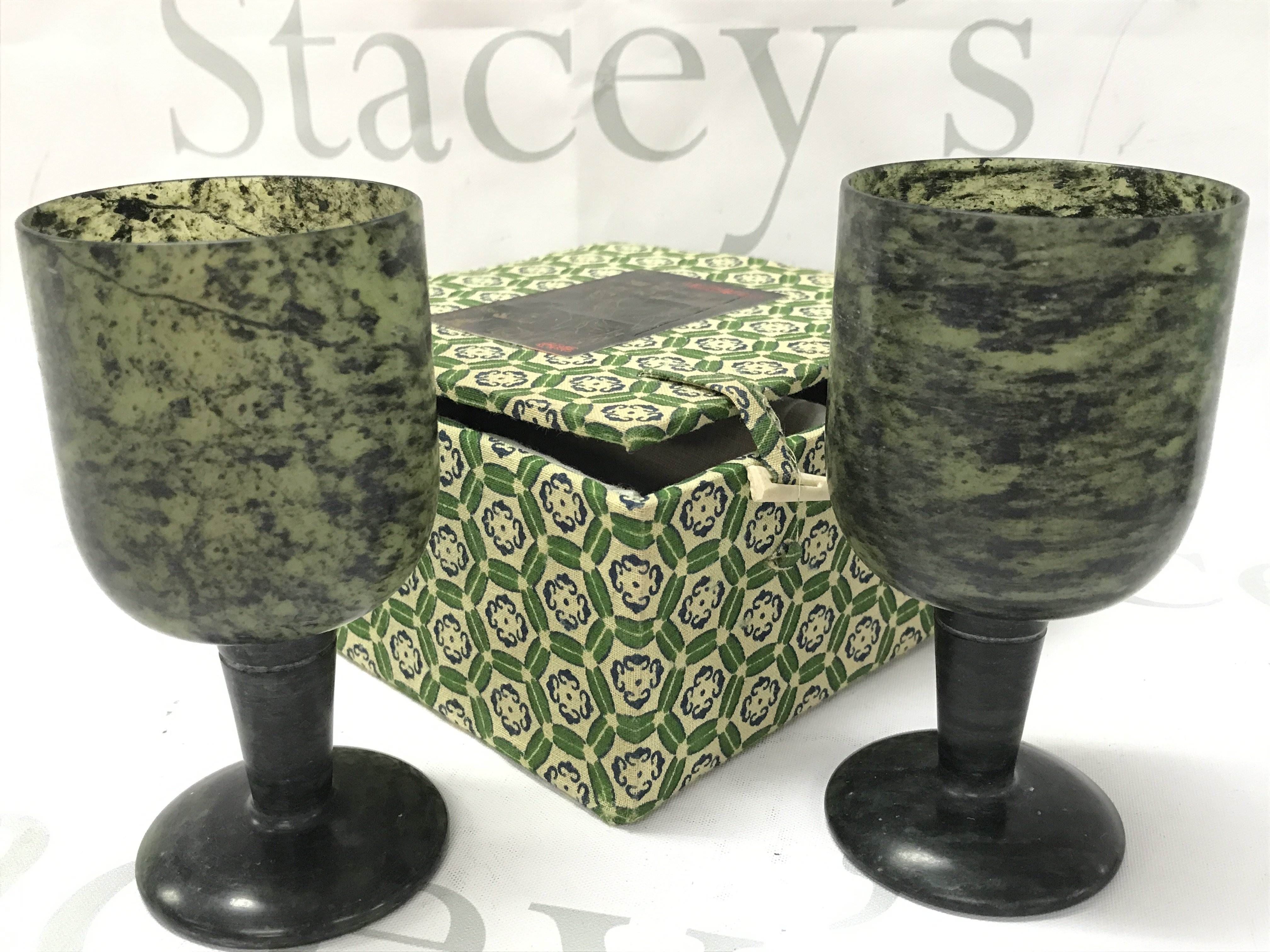 A pair of boxed spinach jade goblets, 12cm tall. This lot cannot be posted