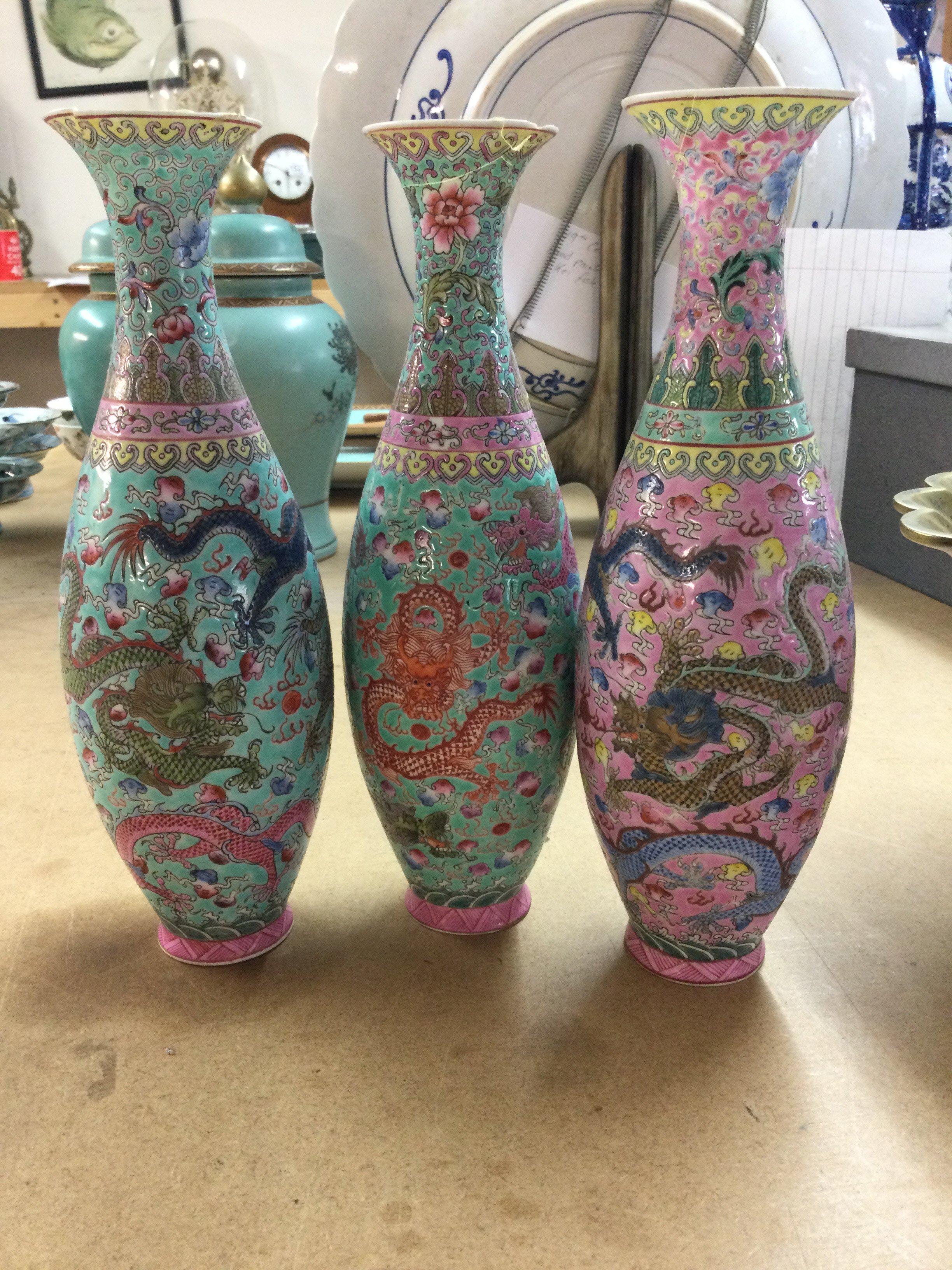 Three Republic vases decorated with dragons flowers foliage . 23 cm .