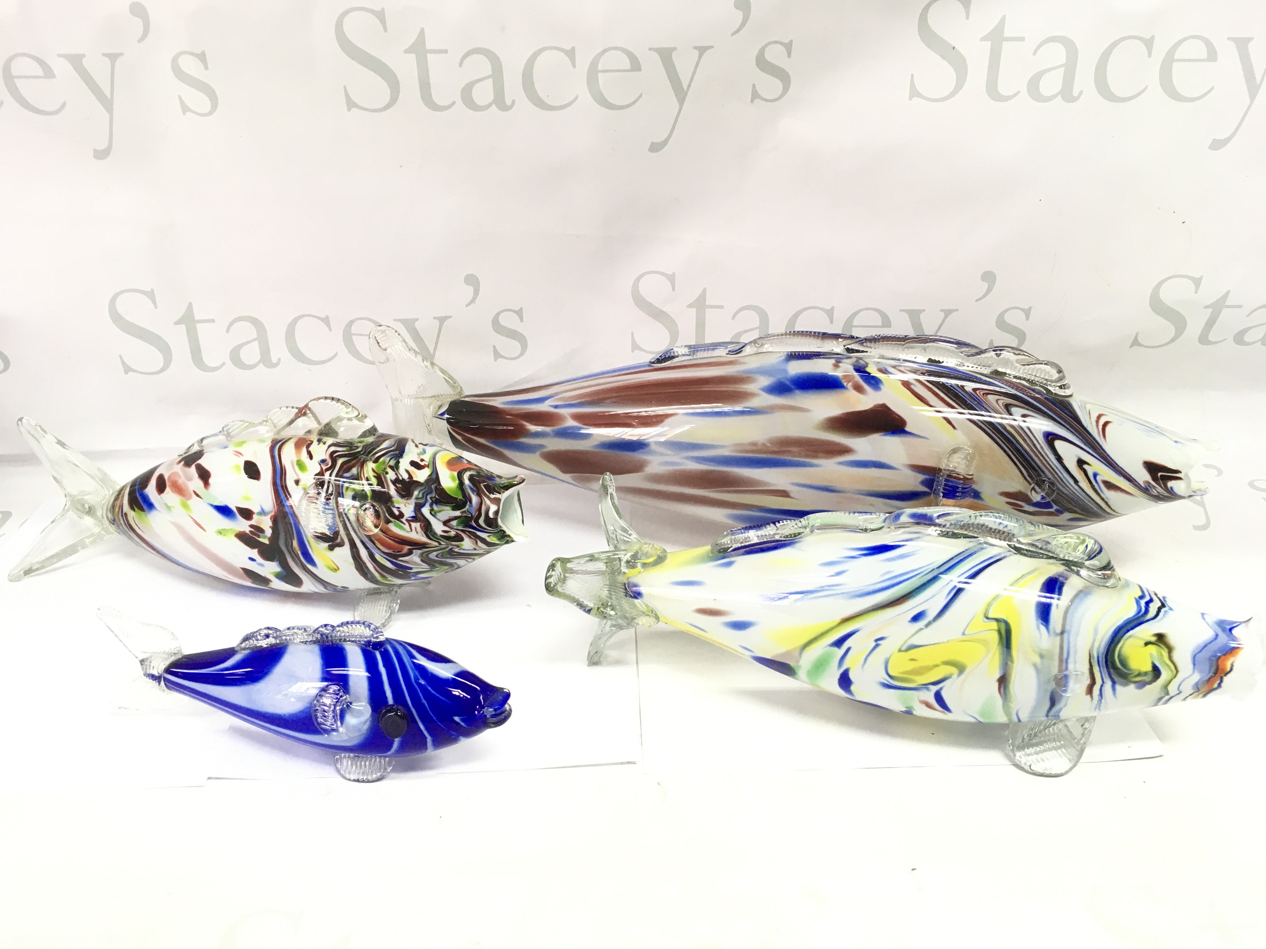 A collection of four assorted Murano coloured glass fish. Postage D