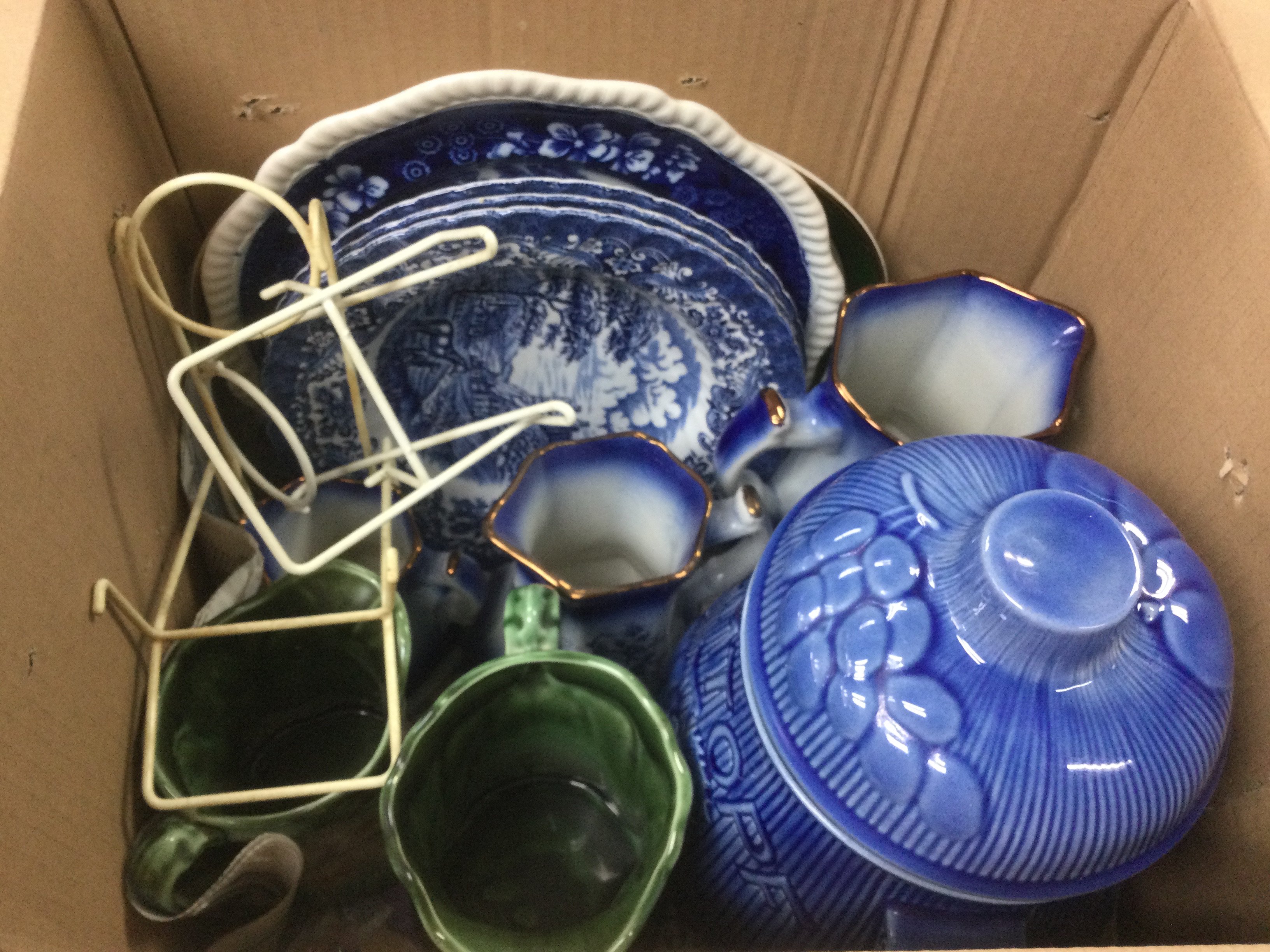 Two boxes of ceramic items comprising mainly blue and white items. Shipping category D.- NO RESERVE