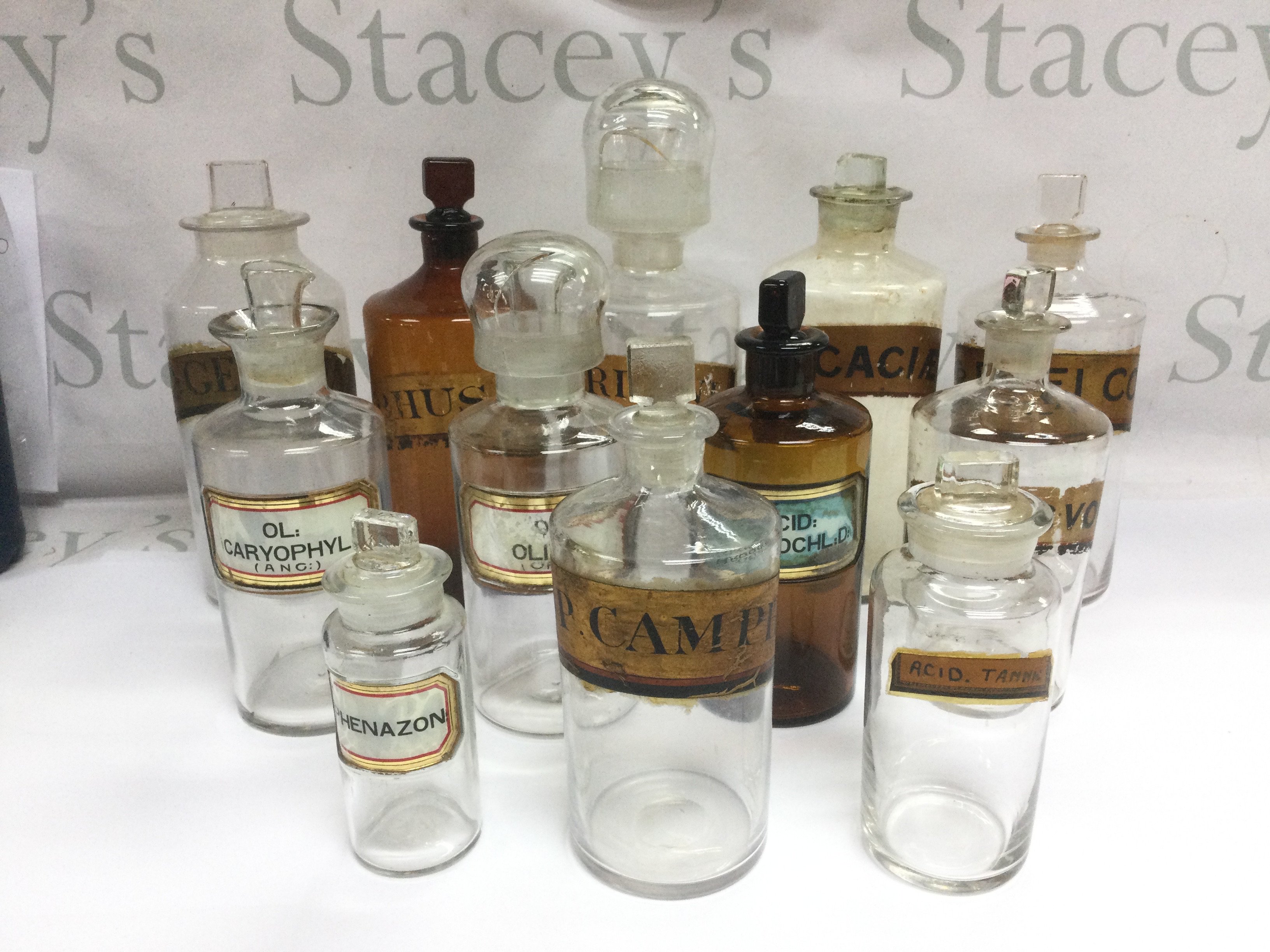 A collection of 12 glass apothecary jars. Shipping category D.