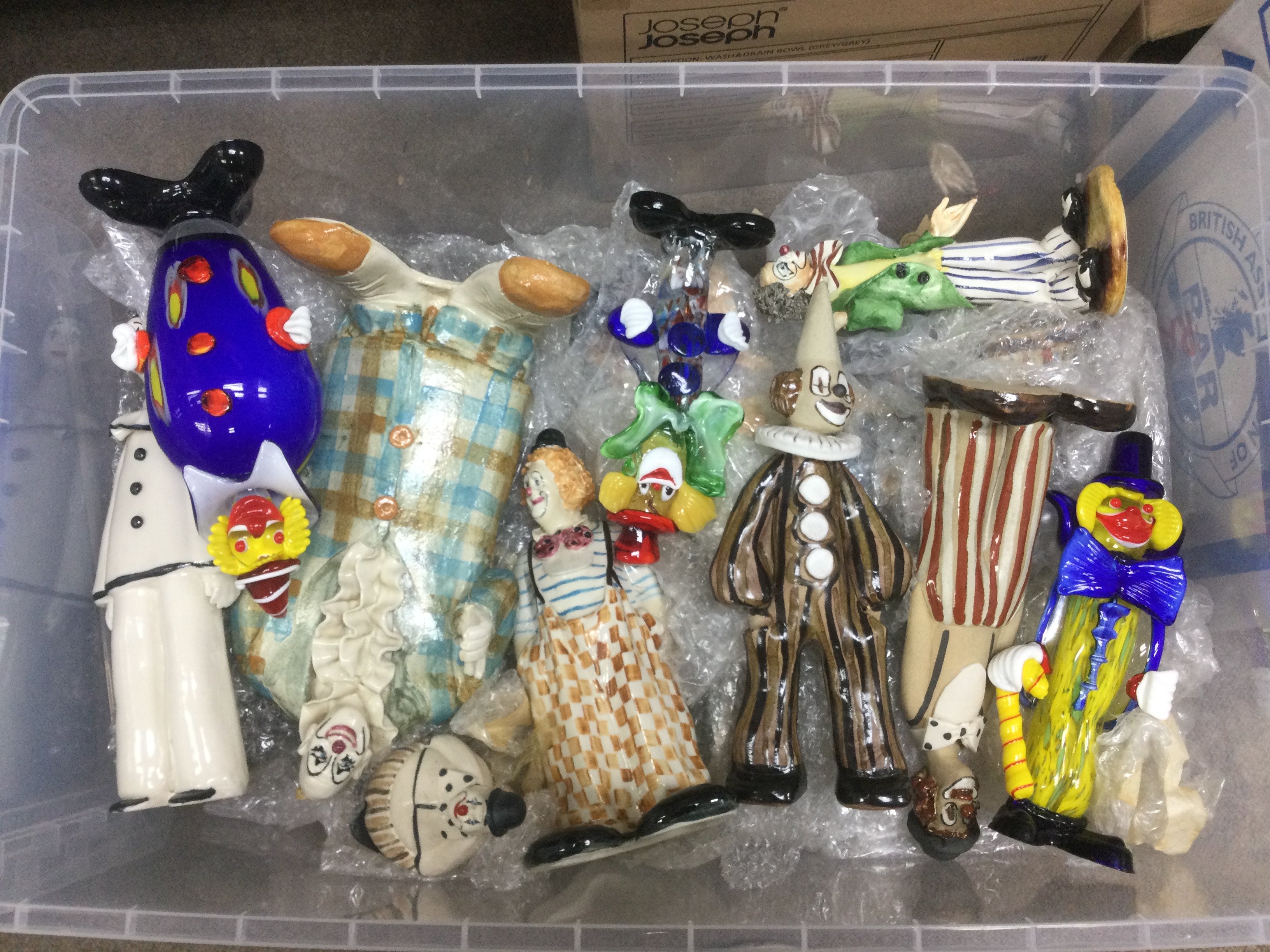 A large collection of Elizabeth Haslam pottery clowns plus some Murano glass clowns. Shipping category D.