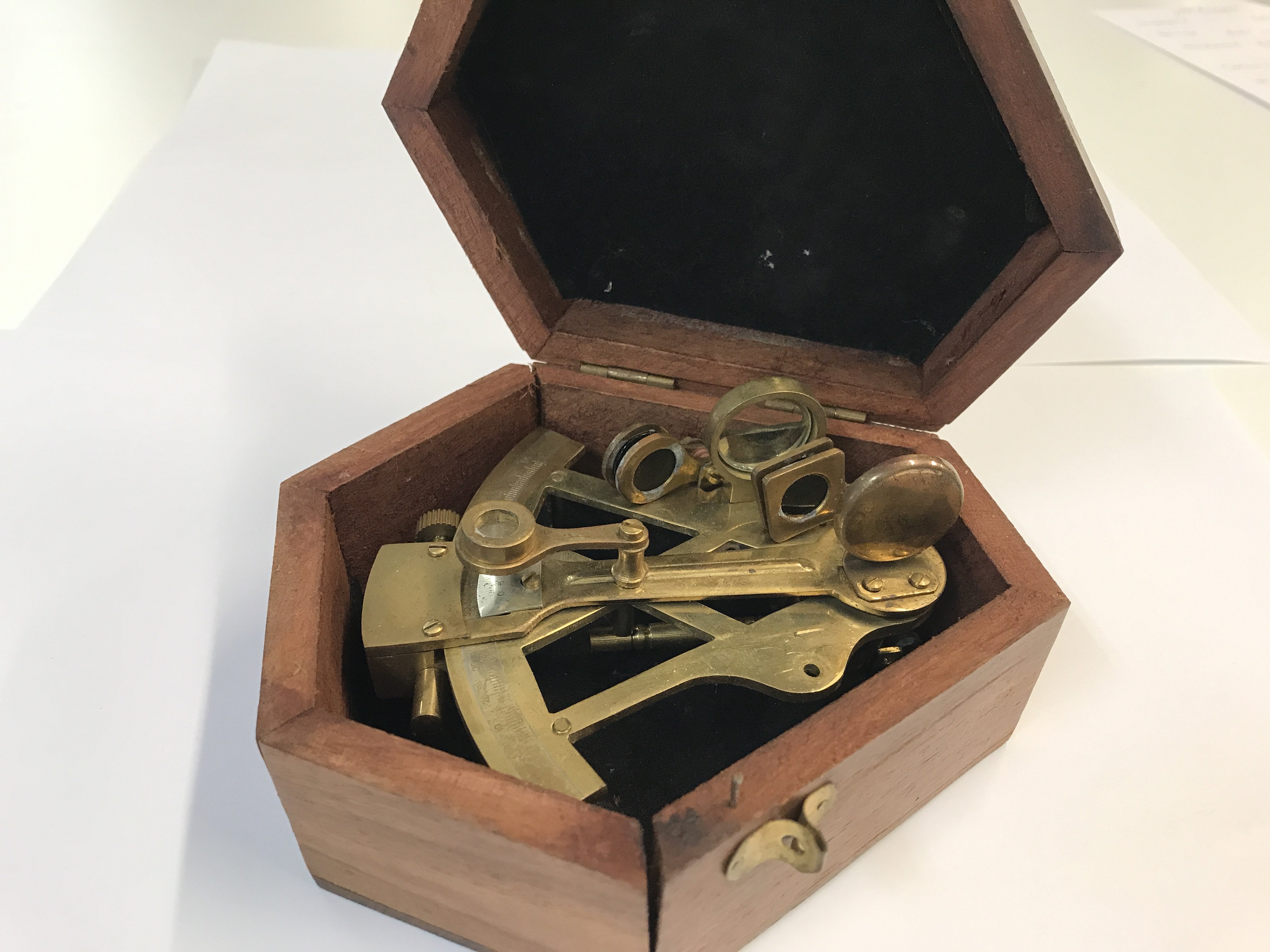 A reproduction navy brass sextant in a fitted box.