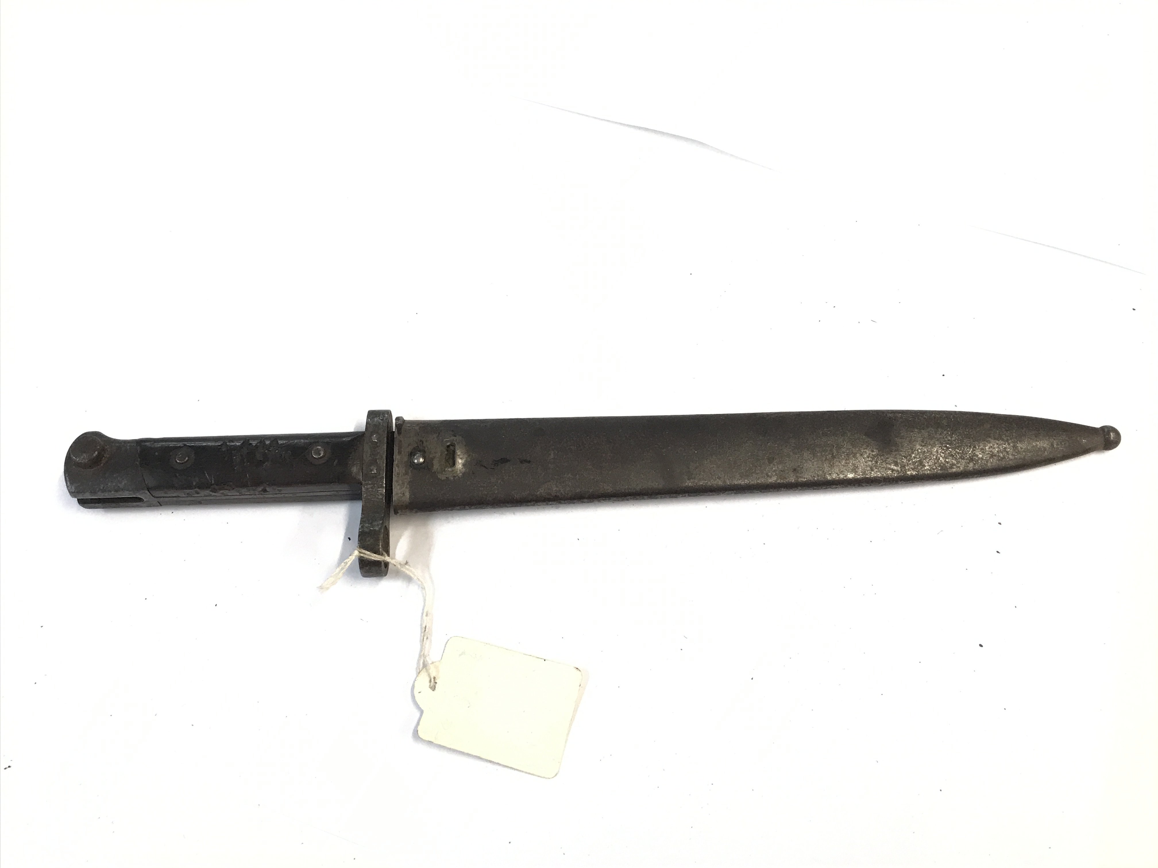 An Austrian Imperial German bayonet possible an early M84 model with wood grip steel scabbard some marks to the blade.