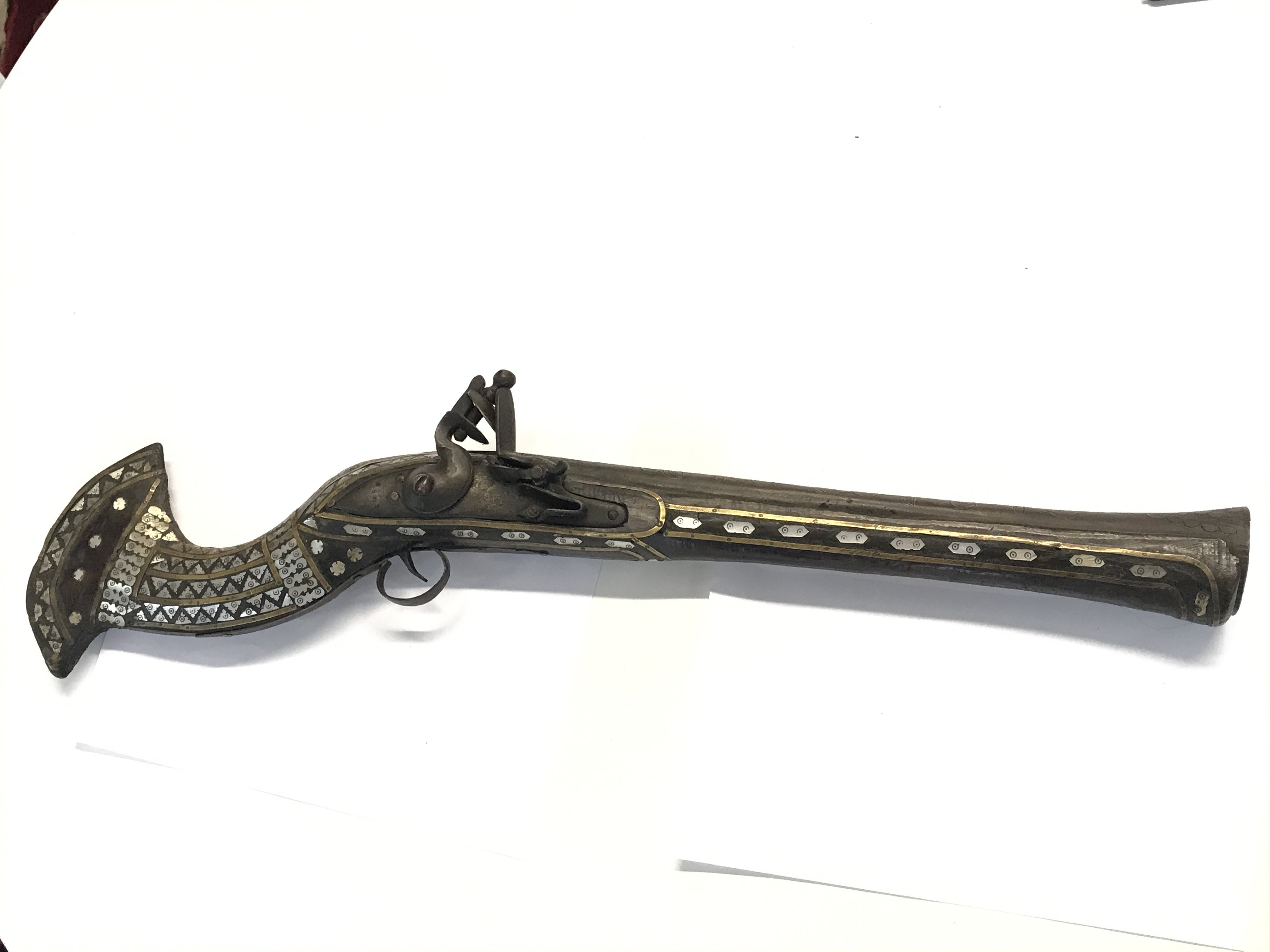 An unusual Indian Flint lock Blunderbuss with mother of pearl inlay the barrel with engraved floral motifs.