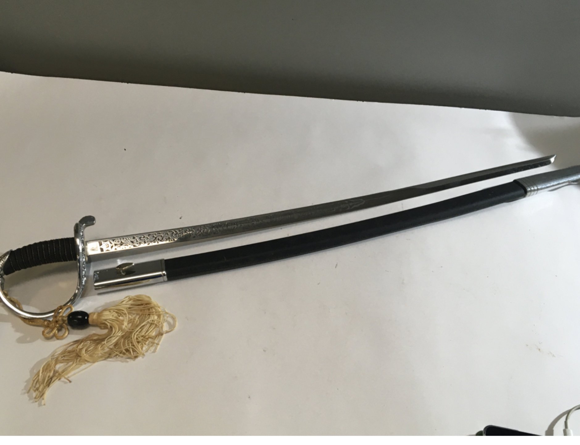 A 20th Century chrome finish cavalry sword ,Quality retrospective collectors copy An American Cavalry sword with elaborate blade engraved United States Marines.