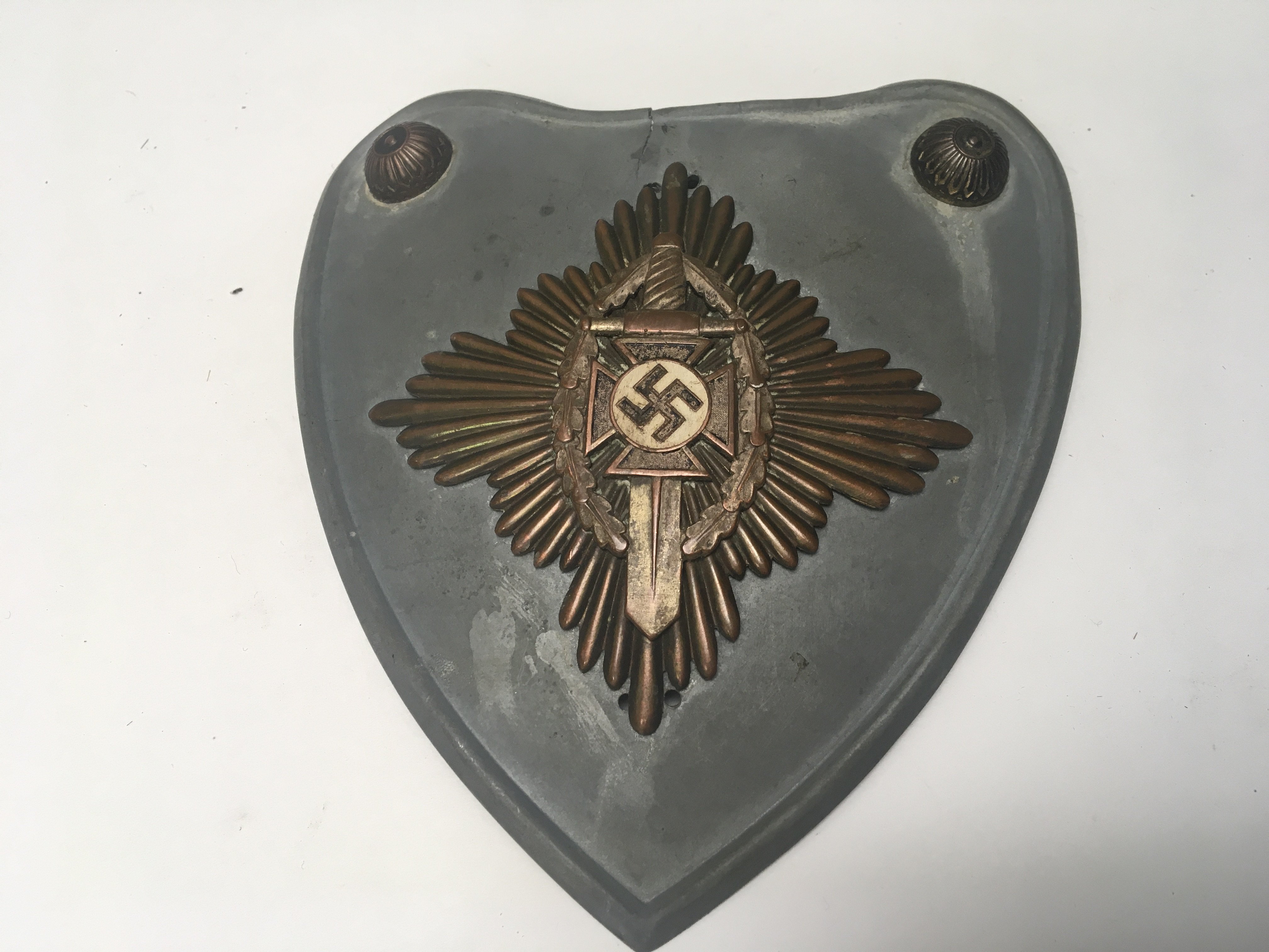 A rare and appearing to be authentic German NSKOV standard bearers Gorget. the condition in keeping with age with later drill holes possible previously mounted on a plaque.
