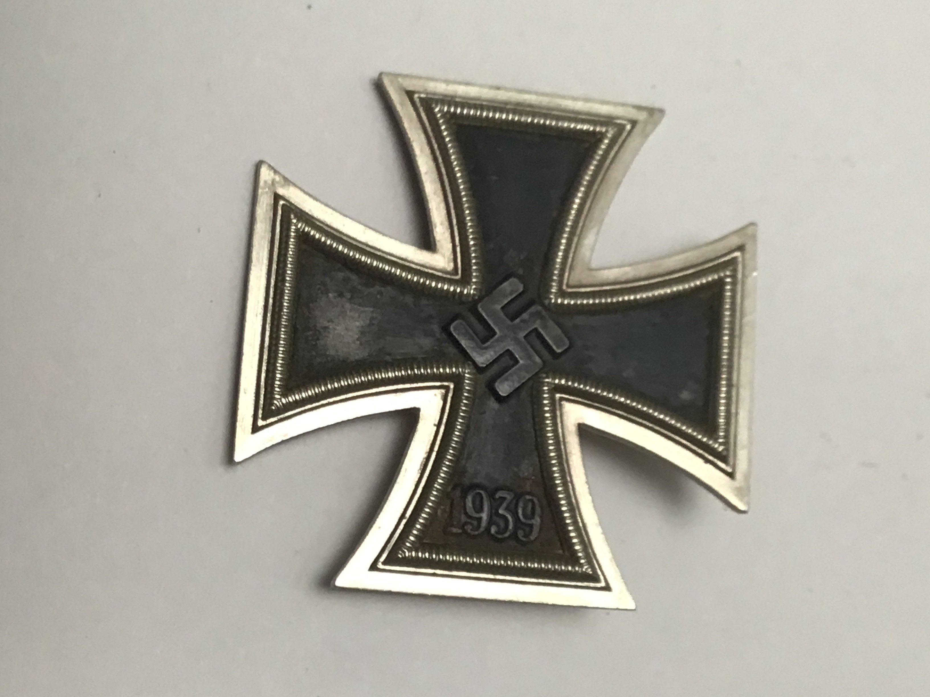 A German Third Reich II world war Iron cross 1939 the pin stamped L15 the badge with authentic wear in keeping with age.
