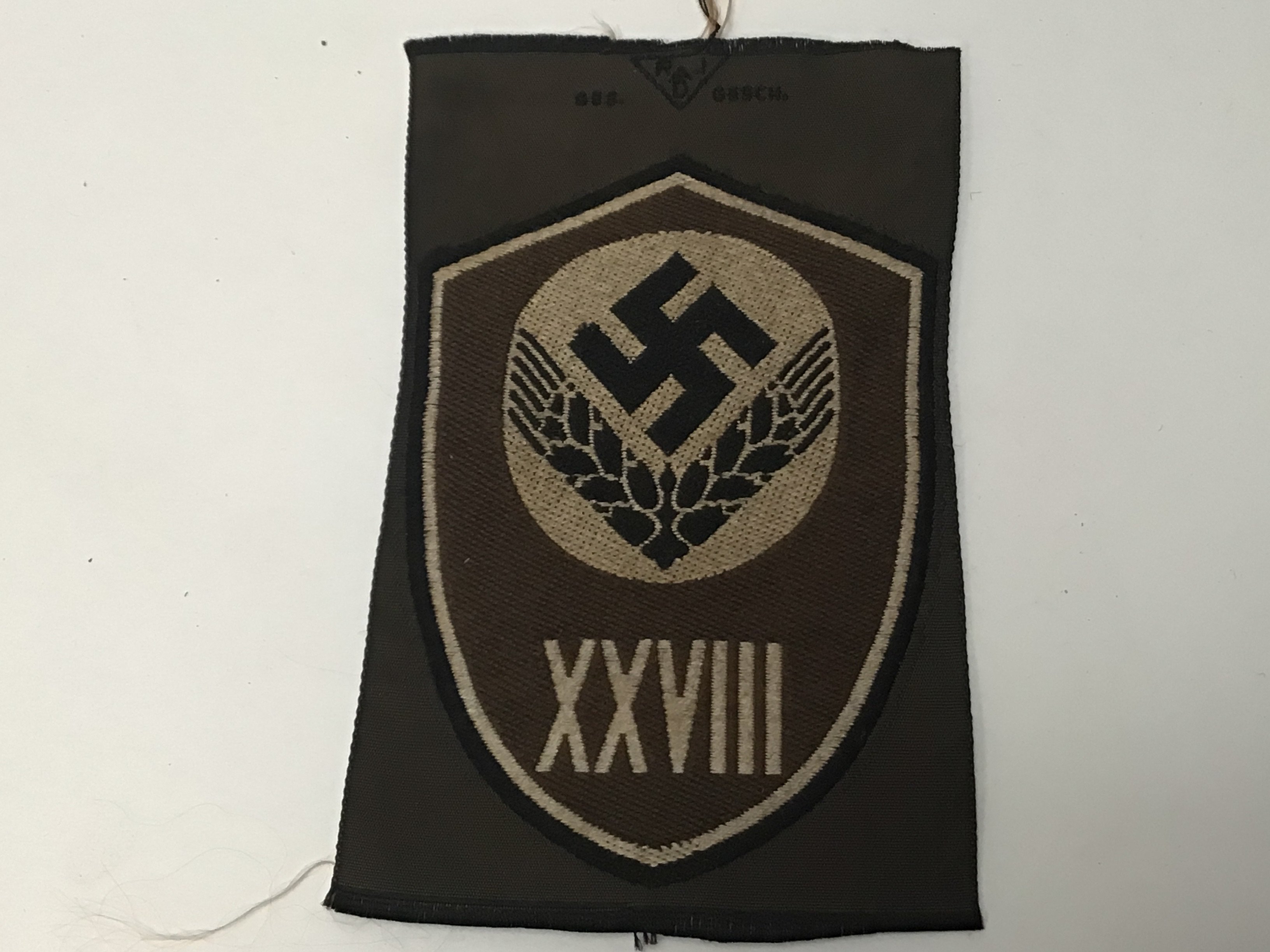 A German Third Reich Wehrmacht 28th Division labour force unused cloth badges.