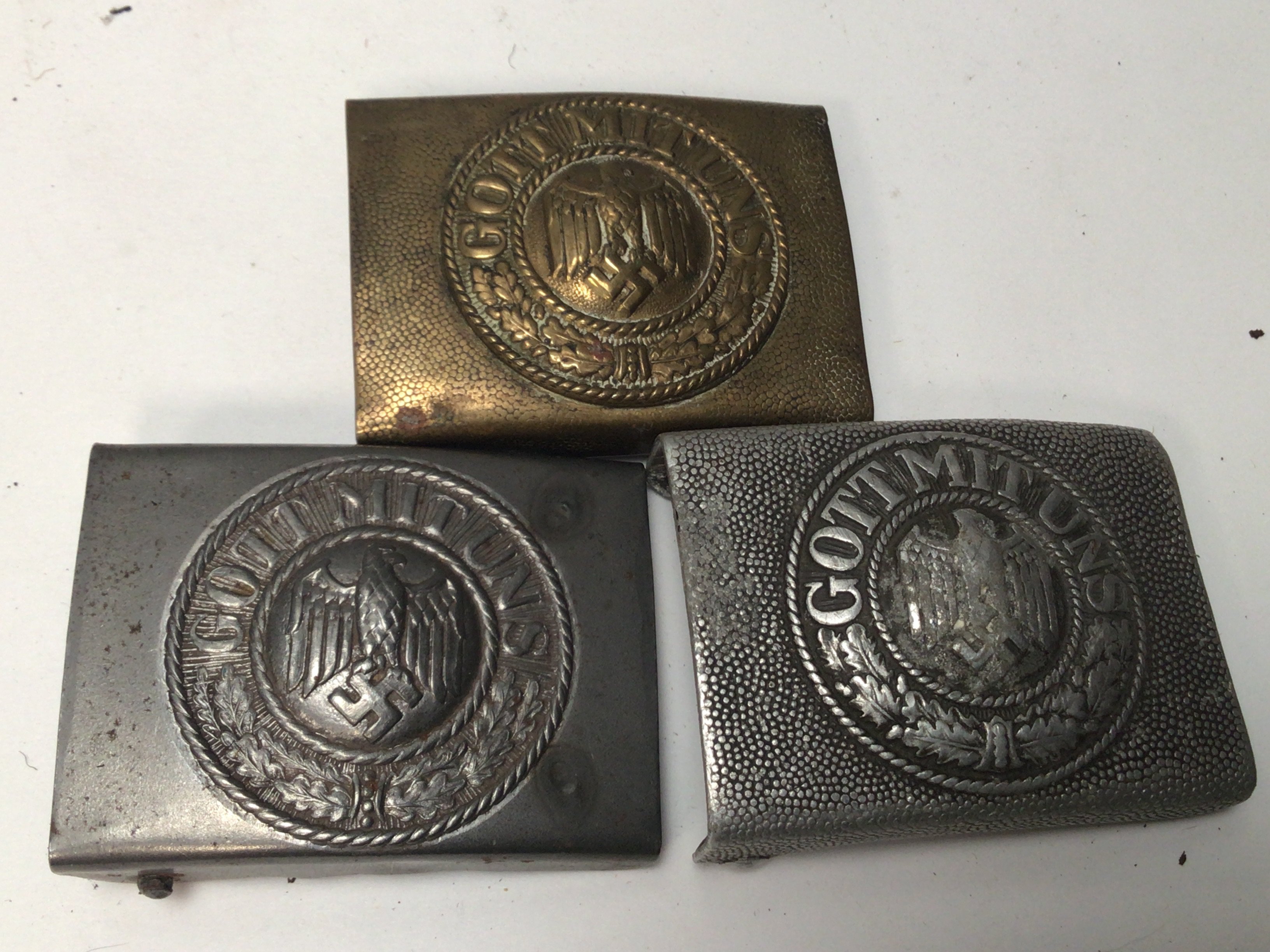 Three German Third Reich Army belt buckles with central Eagle one with a brass finish (3)