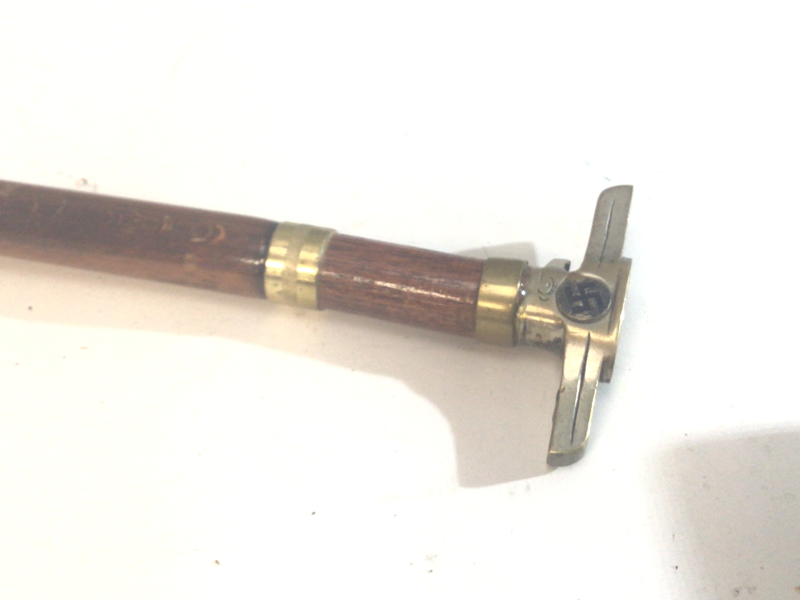 A Walking stick the top with shaped metal end and stamped marks see images.