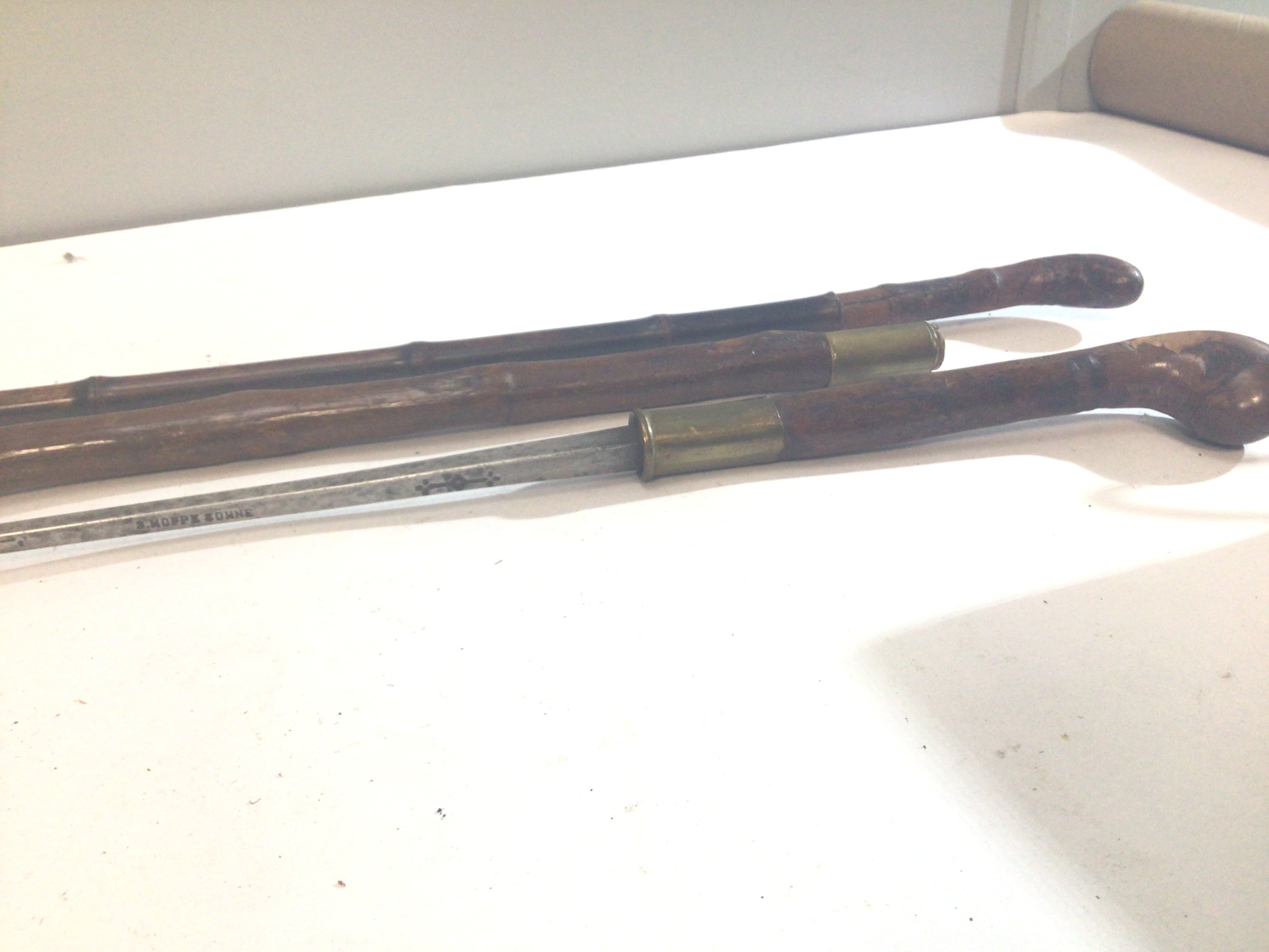 An Antique German sword Stick possibly hawthorn with a steel blade maker S Hope Sohne Solingen and one other sword stick (2)