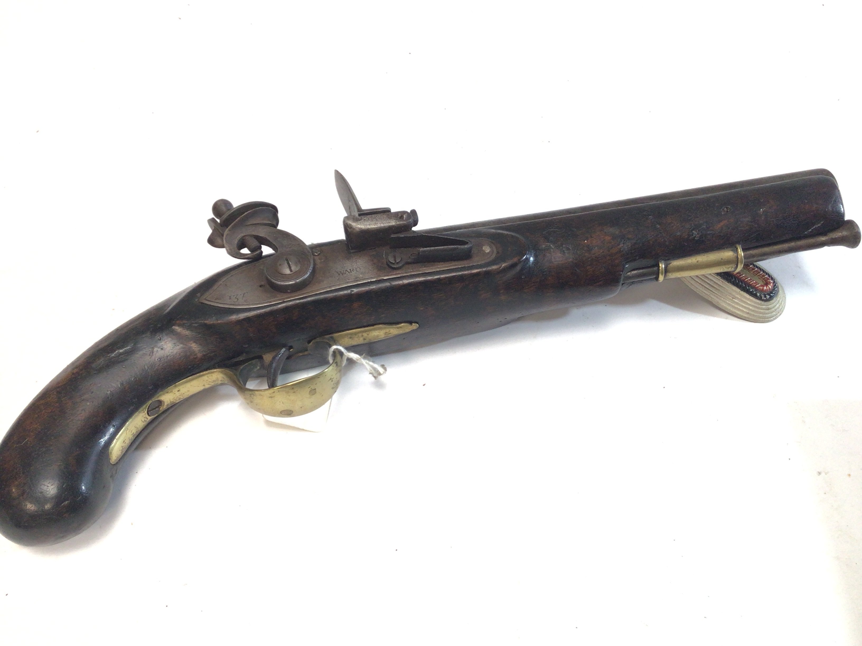 A late 18th century flintlock pistol with brass fittings steel barrel and action stamped 137 Ward.