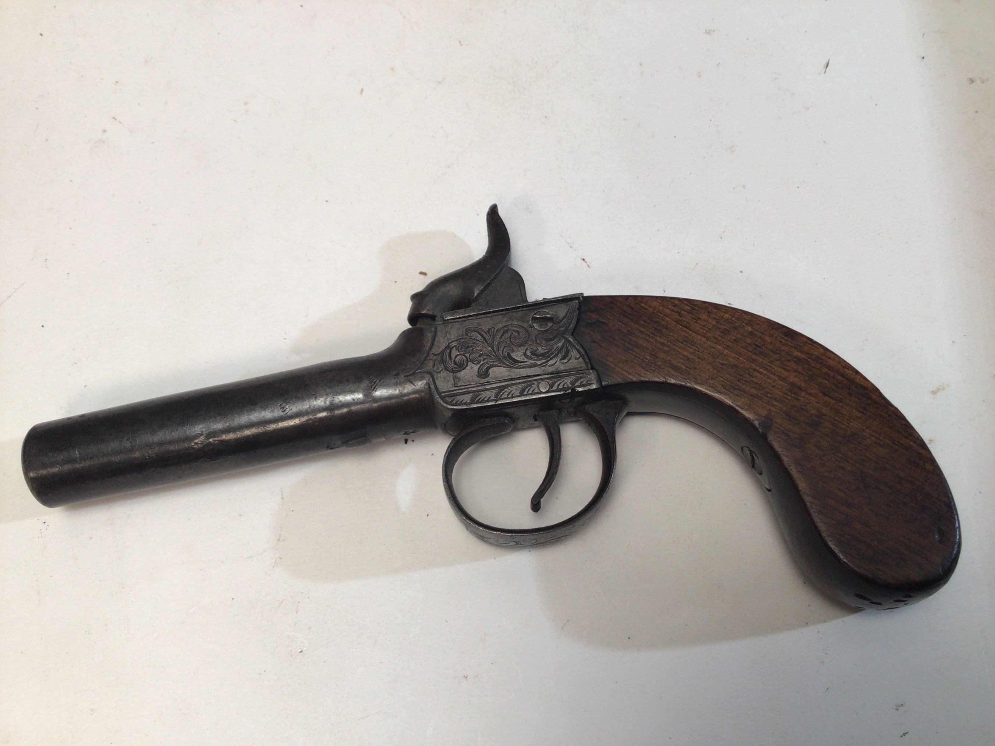 A 19th century slab sided Percussion pistol engraved action maker Strowse Brompton