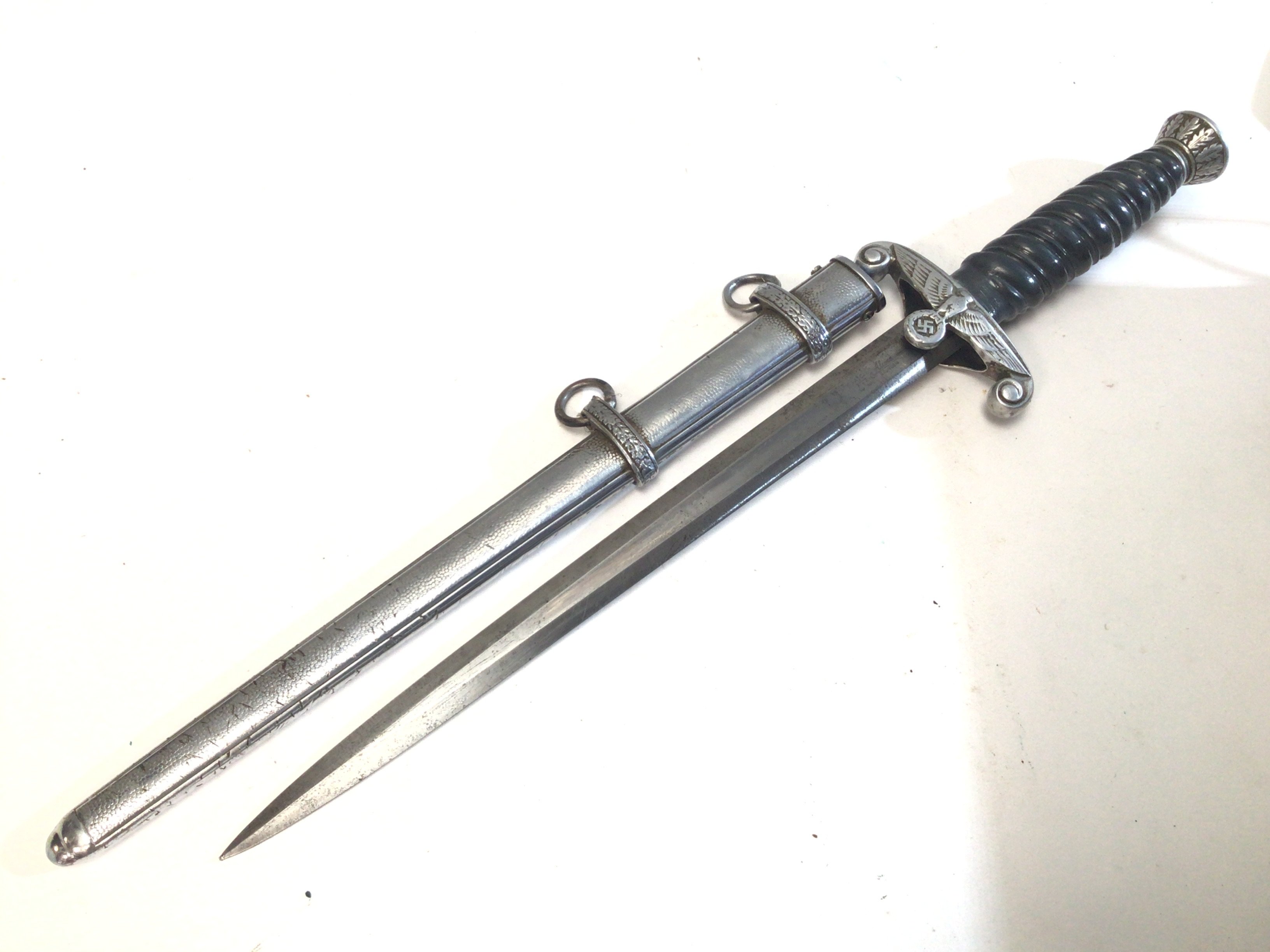 A Rare First patter German II world war Third Reich Richsbahn Railway presentation dagger. Maker Alcosa Solingen with patterned scabbed.