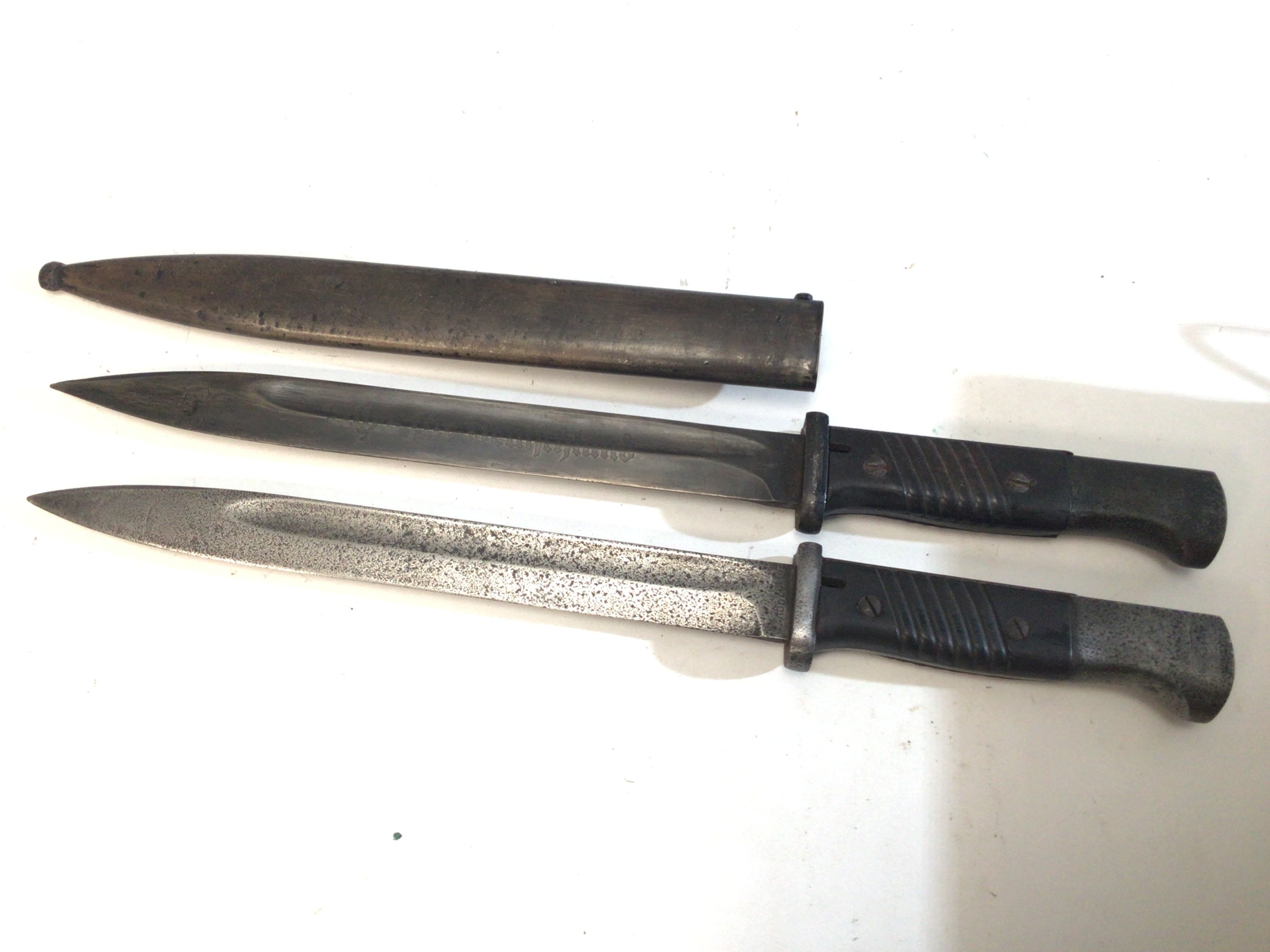 A German Third Reich II world war K98 bayonet the blade etched Alles Fur Deutschland.also stamped with maker&rsquo;s initials WKC. and one other K98 bayonet no scabbard (2)