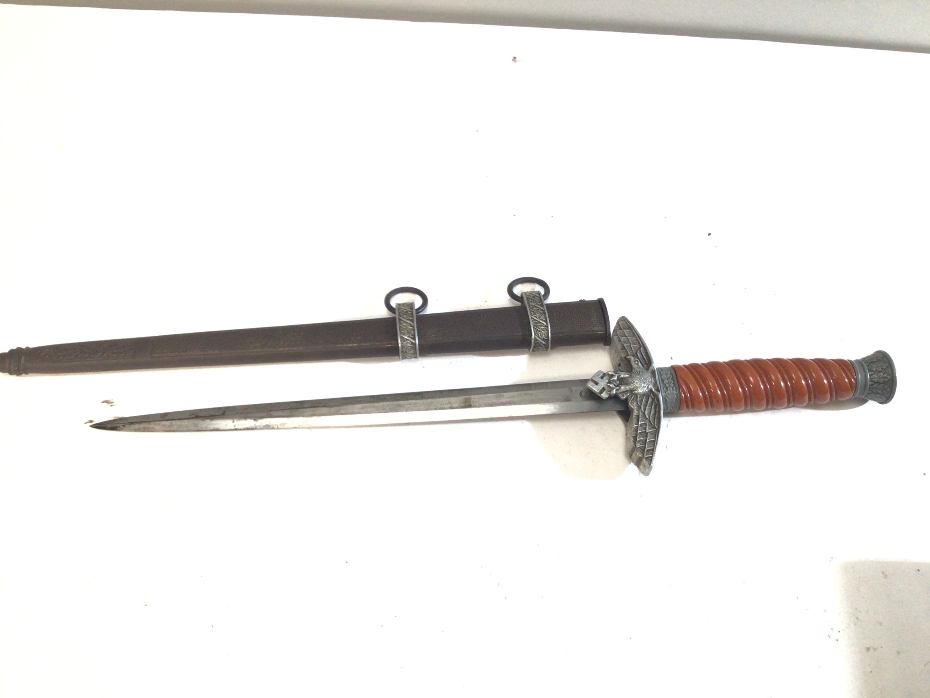 A German Third Reich dagger possibly matched fittings Luftwaffe and German Military. blade with makers stamp.