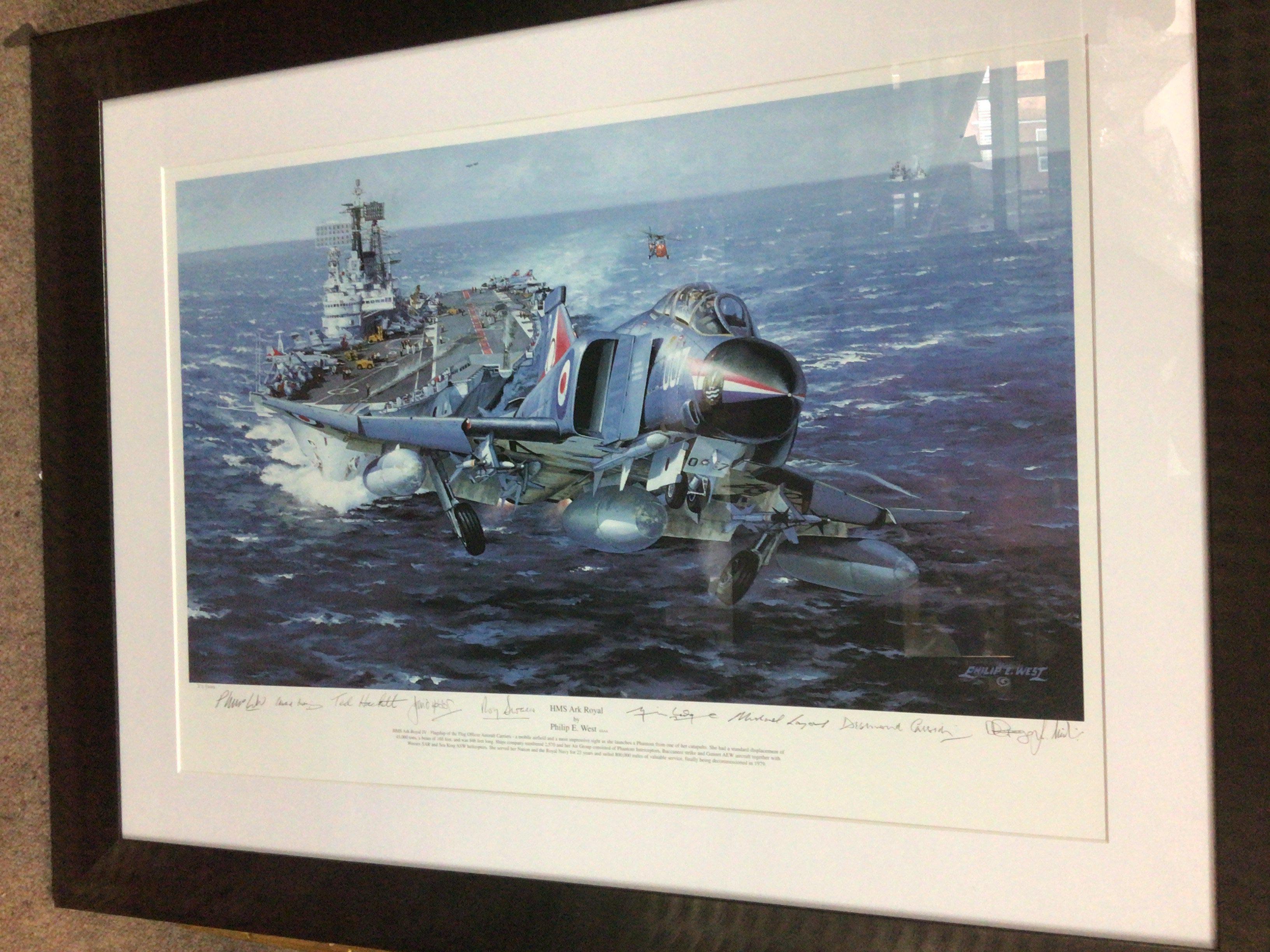 A framed coloured print study of HMS Ark Royal by Philip West with several crew signatures.