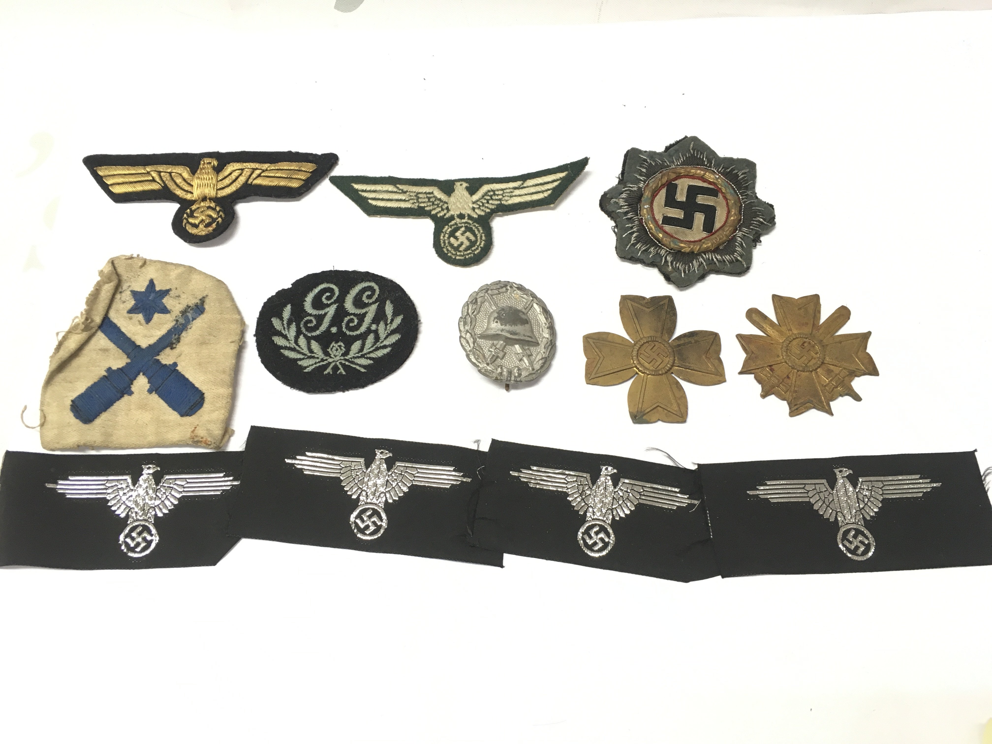 WW2 German Third Reich silver wound badge , Panzer breast eagles, German cross in gold, British naval cloth badge, Ground gunner badge. Postage category A