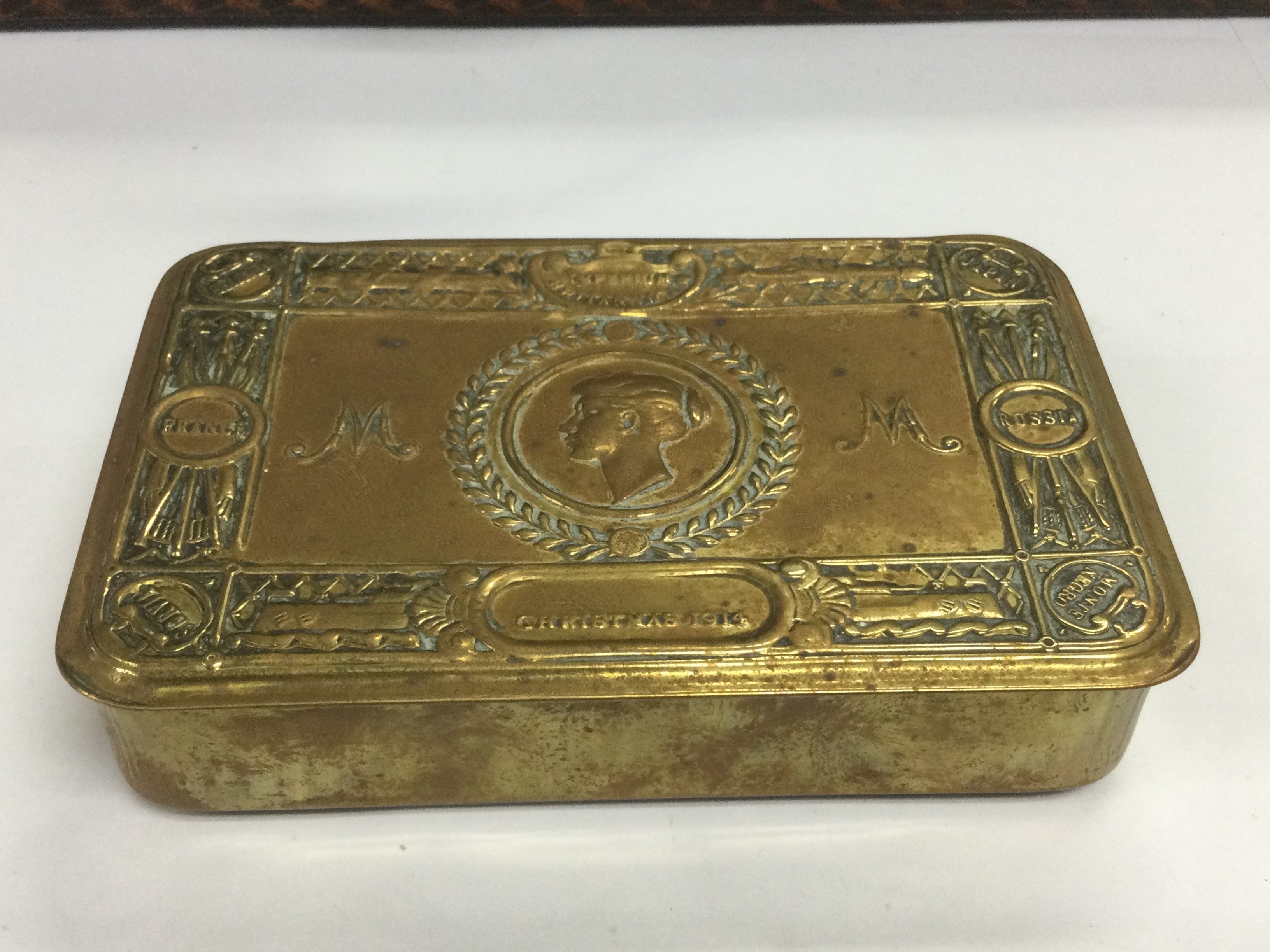 A WW1 Princess Mary tin and various enamel badges and tunic buttons Shipping category B.