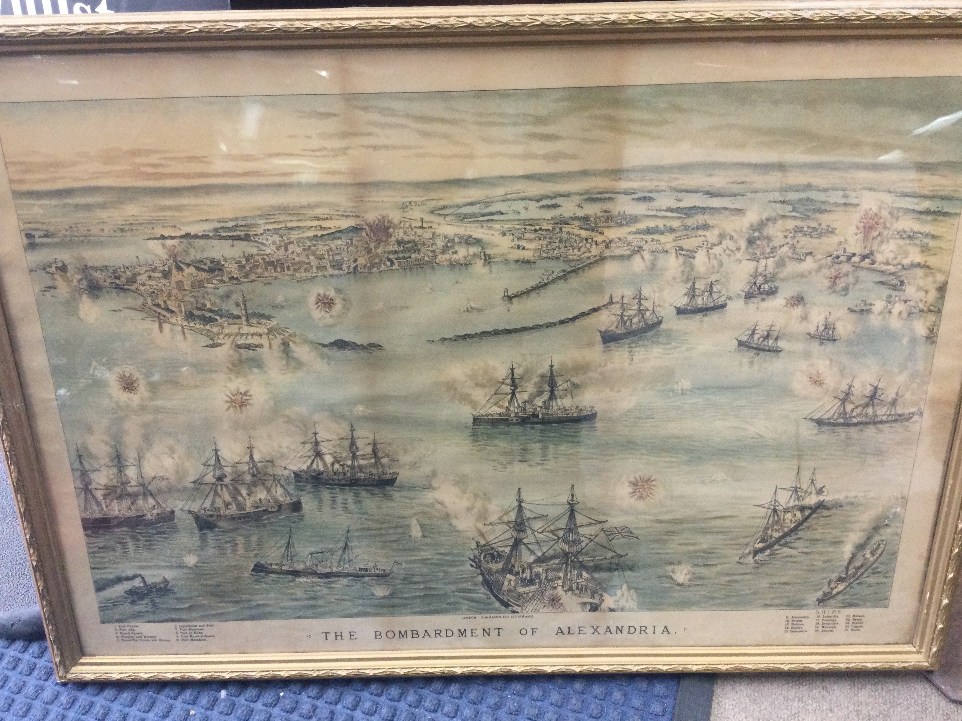 Two late 19th century framed military Lithographs , birds eye view of the battle of Tel- El- Kevin and the bombardment of Alexandria. Dimensions 79x58cm . This lot can be posted without their frames (cat B)