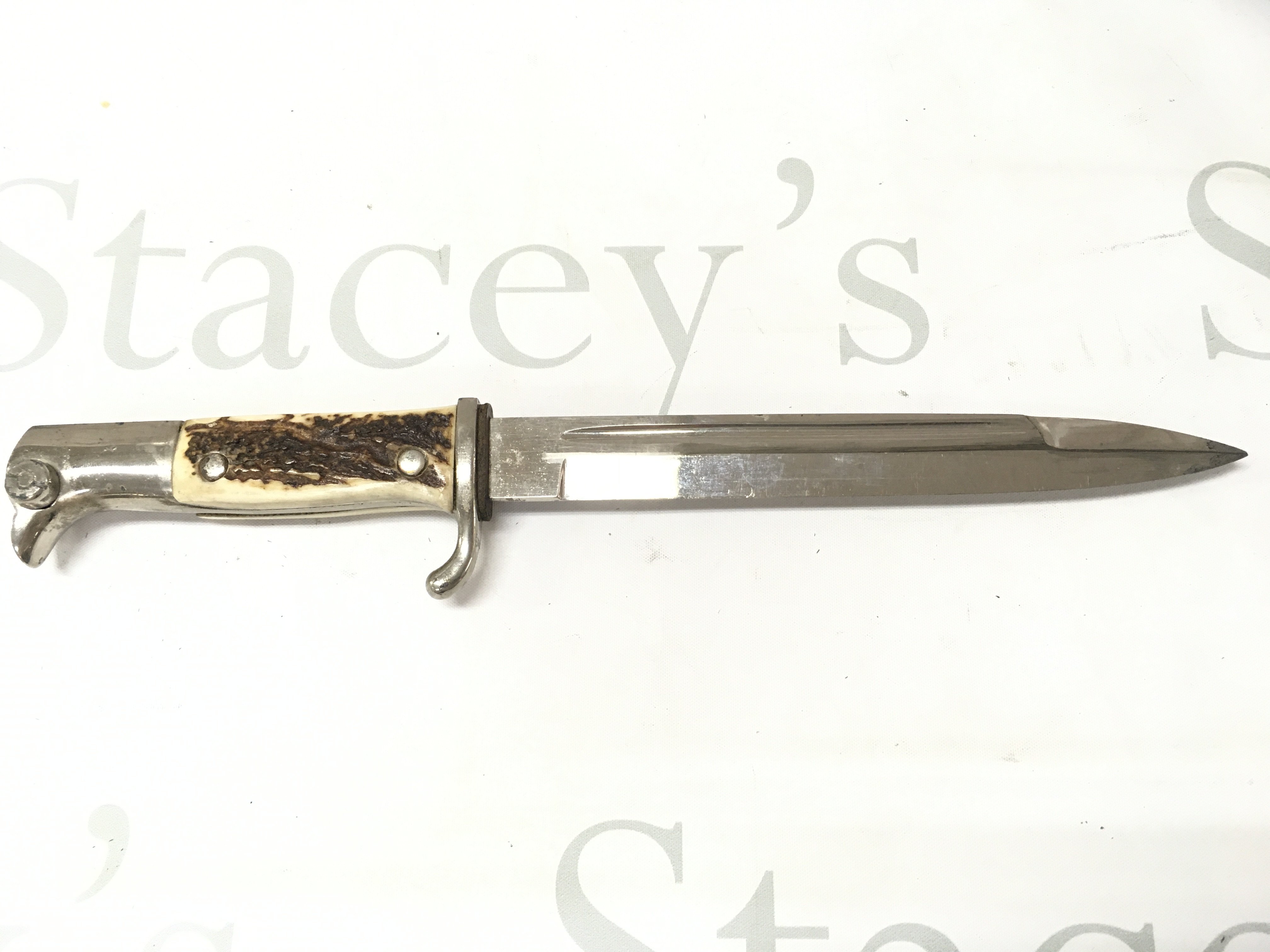 A WW2 Third Reich Dren Bayonet by E Pack & Sohne ,Solingen with stag horn grip and black leather frog . This lot cannot be posted