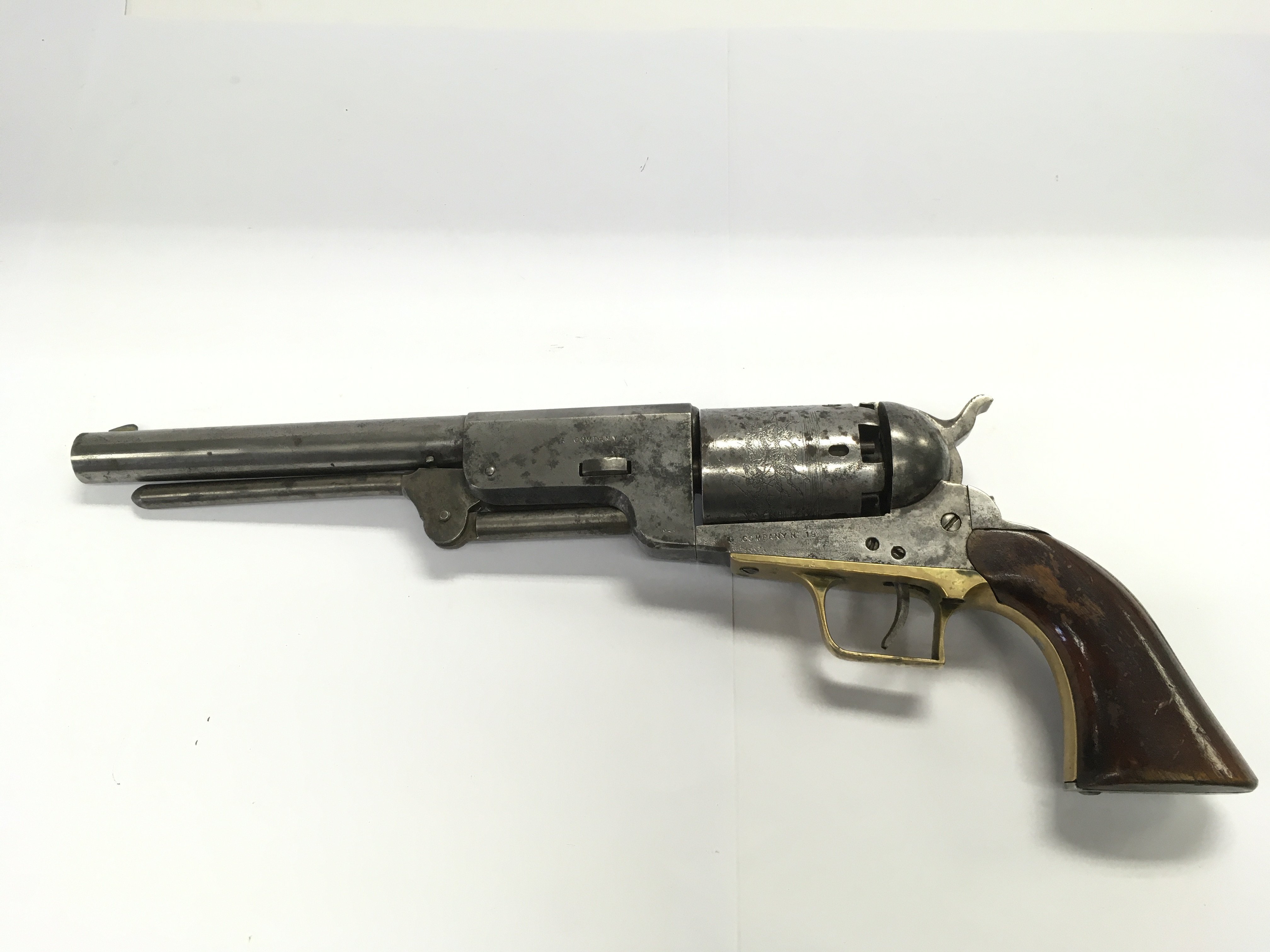 A rare antique percussion cap Sam Colt revolver with some possible later alterations. The engraved cylinder stamped Company No19. Please note that buyers must satisfy themselves as to the authenticity of this item before bidding. Shipping category D.